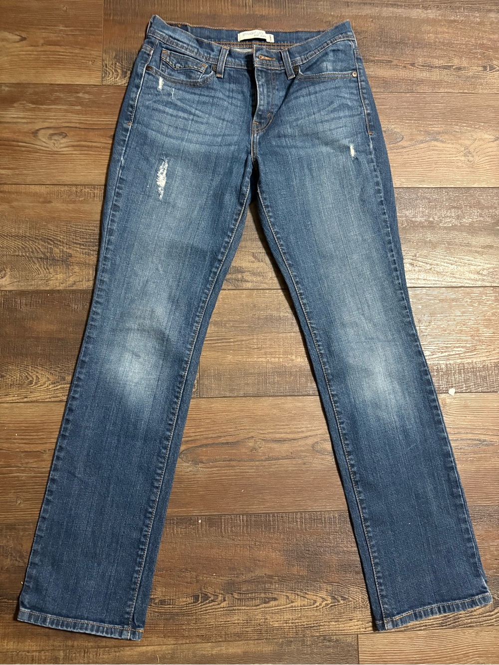 Levi's Medium Blue Straight-Leg Jeans with Subtle Distressing